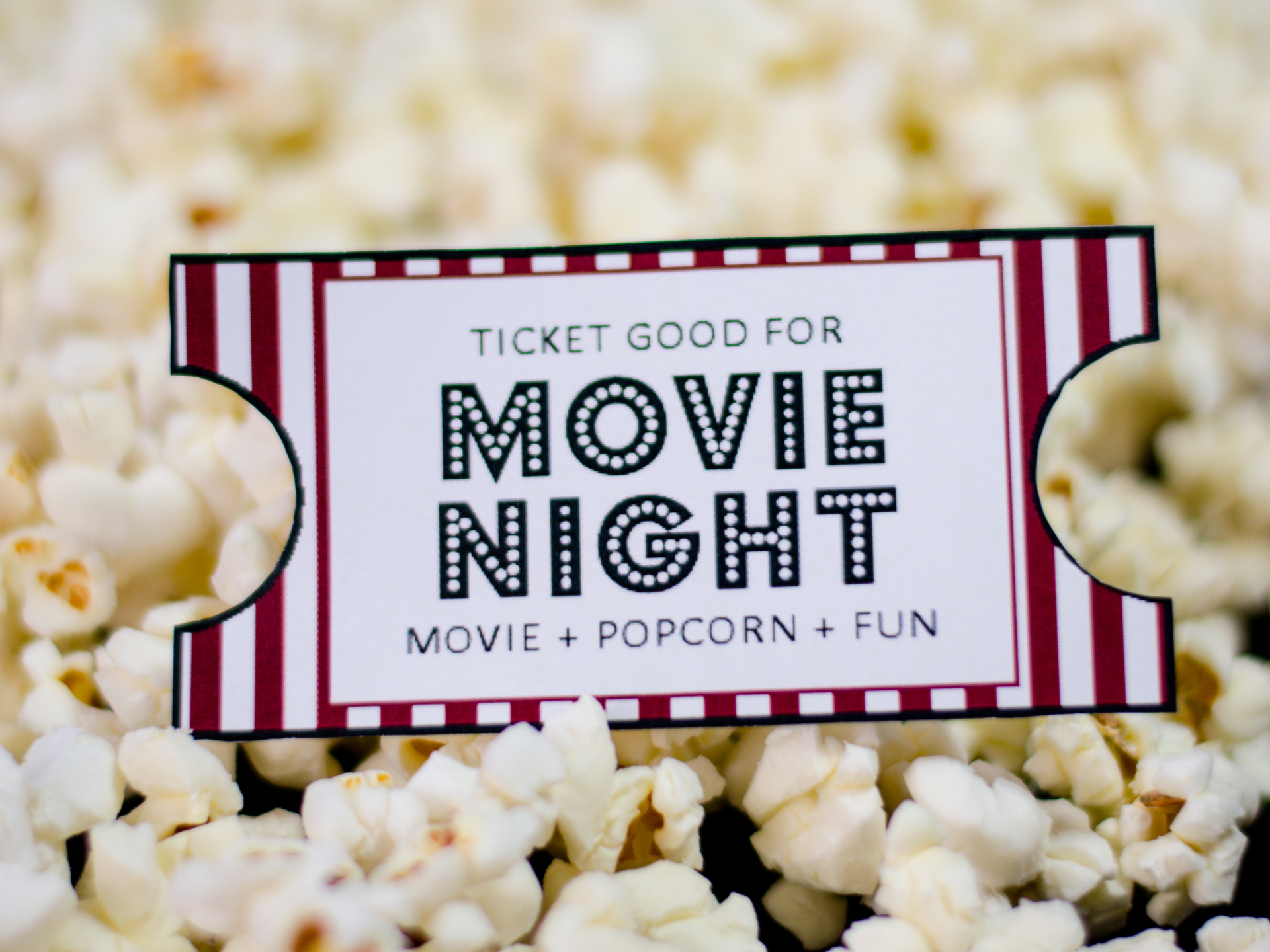 Movie Night ticket surrounded by popcorn